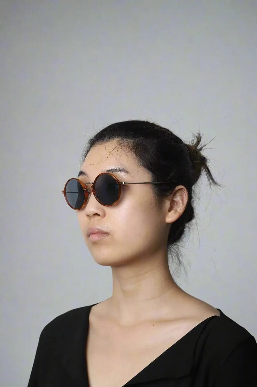 Brown tortoise shell round-frame sunglasses